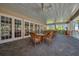 Community patio with wicker furniture, perfect for relaxing at 7296 Marathon Dr # 504, Seminole, FL 33777