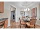 Bright dining area with glass table and four chairs near kitchen at 7296 Marathon Dr # 504, Seminole, FL 33777