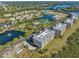 Expansive waterfront community with numerous buildings and green spaces at 7296 Marathon Dr # 504, Seminole, FL 33777
