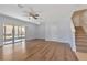 Living room with hardwood floors and sliding glass doors at 12904 Shady Fern Ln, Gibsonton, FL 33534