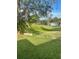 Expansive backyard with lush greenery and mature trees offering shade at 3357 38Th S St # A, St Petersburg, FL 33711