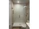 Bathroom featuring a tiled walk-in shower with glass door at 3357 38Th S St # A, St Petersburg, FL 33711