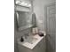 Modern bathroom with a framed mirror, stylish sink, and a sleek white cabinet at 3357 38Th S St # A, St Petersburg, FL 33711
