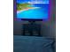 Bedroom featuring a TV on the wall above a cabinet, with a cozy bed in the foreground at 3357 38Th S St # A, St Petersburg, FL 33711