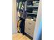 Organized closet with hanging clothes, folded items, and built-in drawers at 3357 38Th S St # A, St Petersburg, FL 33711