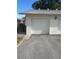 Well-kept detached garage with a white door and convenient driveway parking at 3357 38Th S St # A, St Petersburg, FL 33711