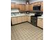 Efficient kitchen features wood cabinets, a new oven, ample counter space, and updated appliances at 3357 38Th S St # A, St Petersburg, FL 33711
