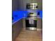 Modern kitchen with light countertops, a tile backsplash, under cabinet lighting, and stainless steel appliances at 3357 38Th S St # A, St Petersburg, FL 33711