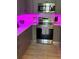 Modern kitchen with light countertops, a tile backsplash, under cabinet lighting, and stainless steel appliances at 3357 38Th S St # A, St Petersburg, FL 33711