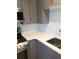 Updated kitchen with a stainless steel sink, modern countertops, and stylish backsplash at 3357 38Th S St # A, St Petersburg, FL 33711