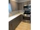 Bright kitchen showcasing stainless steel appliances, attractive cabinets, and elegant countertops at 3357 38Th S St # A, St Petersburg, FL 33711
