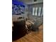 Relaxing living room featuring luxury recliners, a modern flat screen, and ambient lighting near the window at 3357 38Th S St # A, St Petersburg, FL 33711