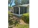 Relaxing screened-in patio featuring outdoor seating and a peaceful setting at 3357 38Th S St # A, St Petersburg, FL 33711