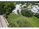Aerial shot of the home's rear, showcasing a spacious backyard, screened in patio and mature landscaping at 3357 38Th S St # A, St Petersburg, FL 33711