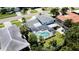 Aerial view showing house, pool, and surrounding homes at 1070 Eden Isle Ne Dr, St Petersburg, FL 33704