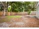 Spacious backyard surrounded by a wood fence, providing privacy and a natural outdoor setting at 3505 75Th N St, St Petersburg, FL 33710