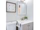 Cozy bathroom with a gray vanity, stylish mirror, and natural light at 3505 75Th N St, St Petersburg, FL 33710