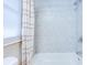 Clean bathroom featuring a shower and tub with tiled walls and a privacy window at 3505 75Th N St, St Petersburg, FL 33710