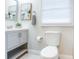 Updated bathroom with a gray vanity, decorative accents, and bright lighting for a clean and refreshing ambiance at 3505 75Th N St, St Petersburg, FL 33710