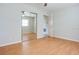 Bedroom with a ceiling fan, mirrored closet doors, and light wood flooring at 3505 75Th N St, St Petersburg, FL 33710