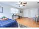 Bedroom featuring wood floors, a ceiling fan, and closet doors at 3505 75Th N St, St Petersburg, FL 33710