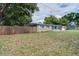 Charming home featuring a well-maintained front yard, fence, and a welcoming light blue front door at 3505 75Th N St, St Petersburg, FL 33710