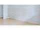 Image shows a tiled room with a white door and neutral-colored walls and flooring at 3505 75Th N St, St Petersburg, FL 33710