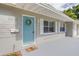 House exterior with light blue door and landscaping at 3505 75Th N St, St Petersburg, FL 33710