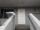 Front entrance with white door and concrete steps at 101 Lake Ne Ave # 222, Largo, FL 33771