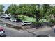 Community parking lot with tennis courts and trees at 101 Lake Ne Ave # 222, Largo, FL 33771