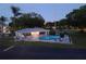 Community pool with lounge chairs and a surrounding fence at 101 Lake Ne Ave # 222, Largo, FL 33771