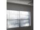 Bright bedroom with window blinds and ceiling fan at 101 Lake Ne Ave # 222, Largo, FL 33771