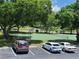 View of a tennis court from a condo parking lot at 101 Lake Ne Ave # 222, Largo, FL 33771