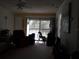 Living room with recliner and access to balcony at 101 Lake Ne Ave # 222, Largo, FL 33771