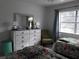 Bedroom with dresser, two beds, and window at 101 Lake Ne Ave # 222, Largo, FL 33771