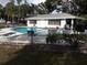 Community pool with surrounding lounge chairs at 101 Lake Ne Ave # 222, Largo, FL 33771