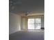 Spacious living room with sliding glass doors and carpet at 101 Lake Ne Ave # 222, Largo, FL 33771