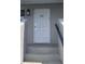 White front door with number 222, leading to condo unit at 101 Lake Ne Ave # 222, Largo, FL 33771