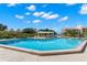 Relaxing community pool with pergola at 203 Mariner Dr # 203, Tarpon Springs, FL 34689