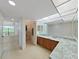Double vanity bathroom with granite countertops and large mirrors at 203 Mariner Dr # 203, Tarpon Springs, FL 34689