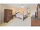 Bright bedroom featuring a queen-size bed and ample closet space at 203 Mariner Dr # 203, Tarpon Springs, FL 34689