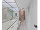 Bathroom features granite countertops and tiled floors at 203 Mariner Dr # 203, Tarpon Springs, FL 34689