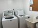 Shared laundry facility with modern appliances at 203 Mariner Dr # 203, Tarpon Springs, FL 34689