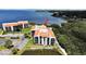 Waterfront condo building with lush landscaping at 203 Mariner Dr # 203, Tarpon Springs, FL 34689