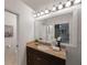 Bathroom with granite countertop, updated vanity, and large mirror at 842 Amelia Ne Ct, St Petersburg, FL 33702