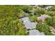 Aerial view showcasing a townhome near a pond and lush greenery at 842 Amelia Ne Ct, St Petersburg, FL 33702