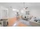 Bright living room with vaulted ceiling, hardwood floors, and neutral color palette at 842 Amelia Ne Ct, St Petersburg, FL 33702