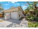 Two-car garage and landscaped front yard at 842 Amelia Ne Ct, St Petersburg, FL 33702