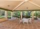 Covered patio with seating area, perfect for outdoor dining at 842 Amelia Ne Ct, St Petersburg, FL 33702