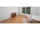 Light and airy bedroom with hardwood floors and a window with shutters at 842 Amelia Ne Ct, St Petersburg, FL 33702